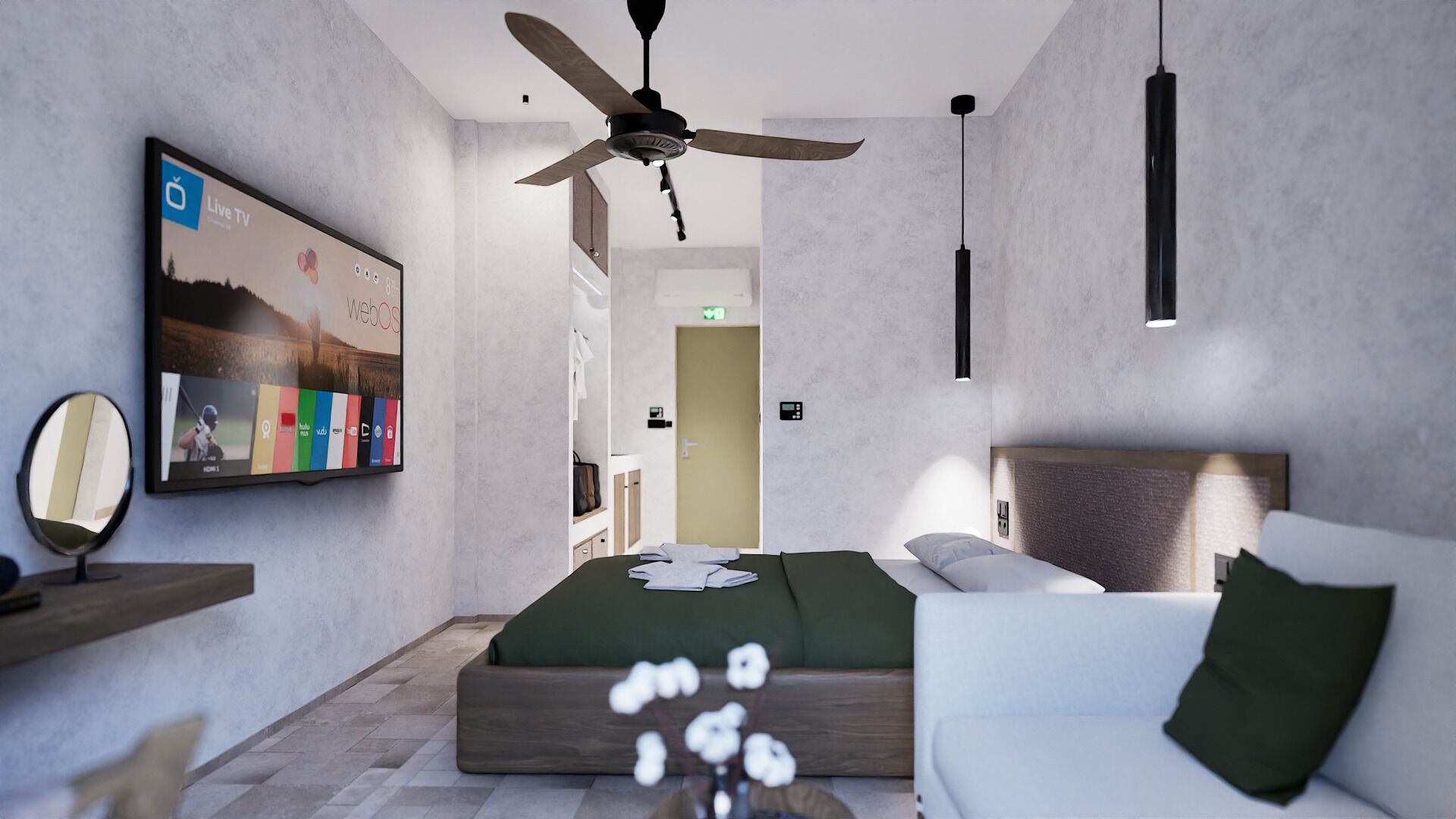 A modern hotel room with a bed, a sofa, a ceiling fan, a mounted TV, and a small table.