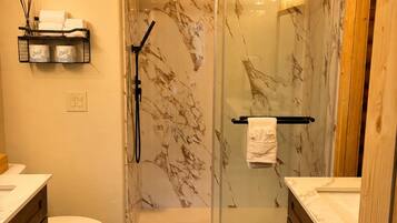 Shower, hair dryer, towels, soap
