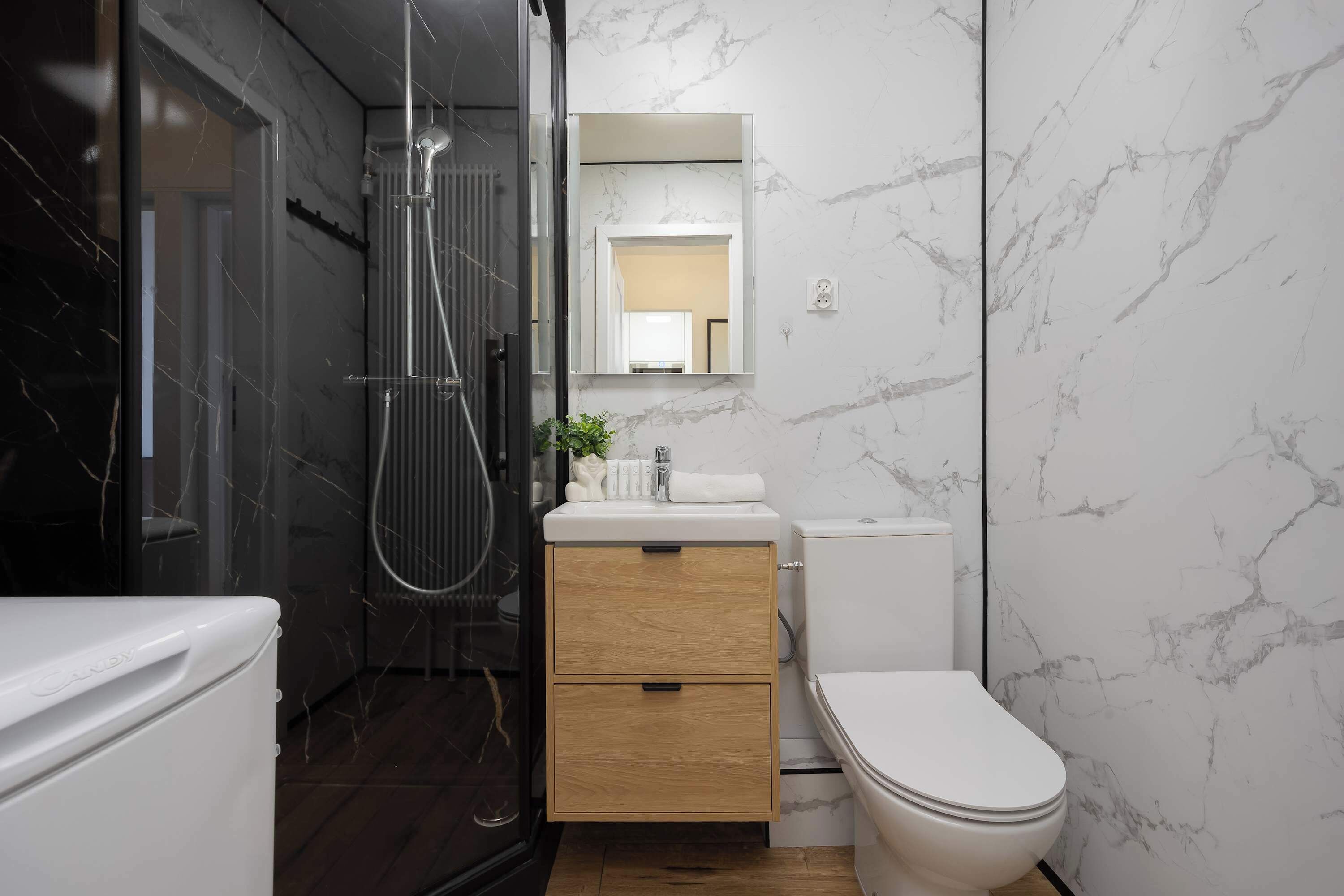 Shower, hair dryer, towels, shampoo
