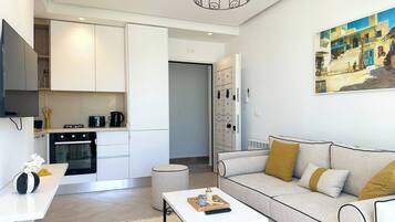Apartamento, 1 quarto | Área de estar