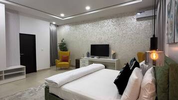 Deluxe Room, Balcony, City View | Desk, laptop workspace, blackout curtains, soundproofing