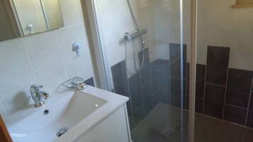 Shower, hair dryer, towels, toilet paper
