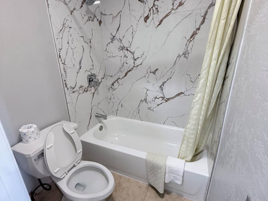 Double Room, 2 Queen Beds, Non Smoking | Bathroom | Bathtub, towels, soap, shampoo