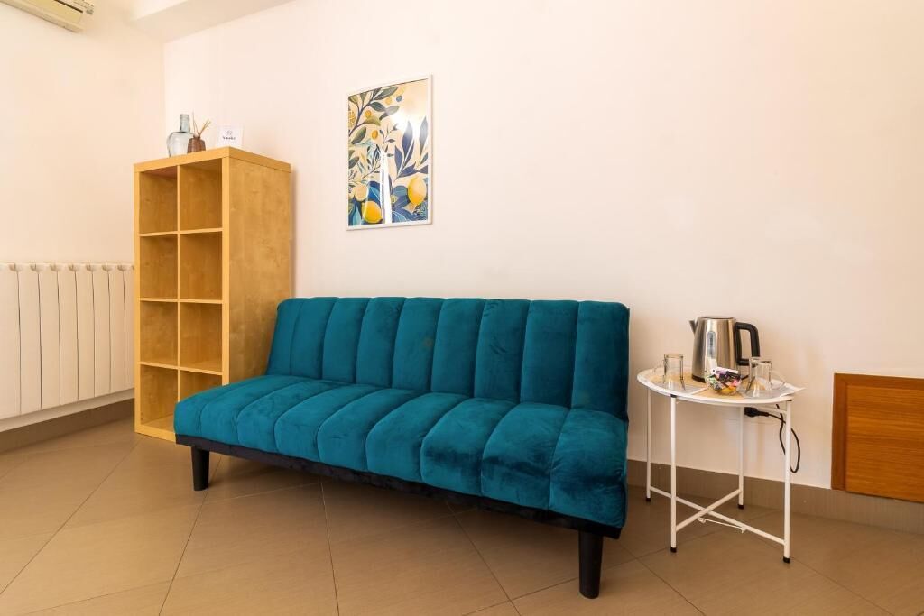 Comfort Triple Room, Balcony, City View | Ruang tamu