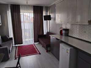 Familie suite, balkon, uitzicht op zee | Woonruimte