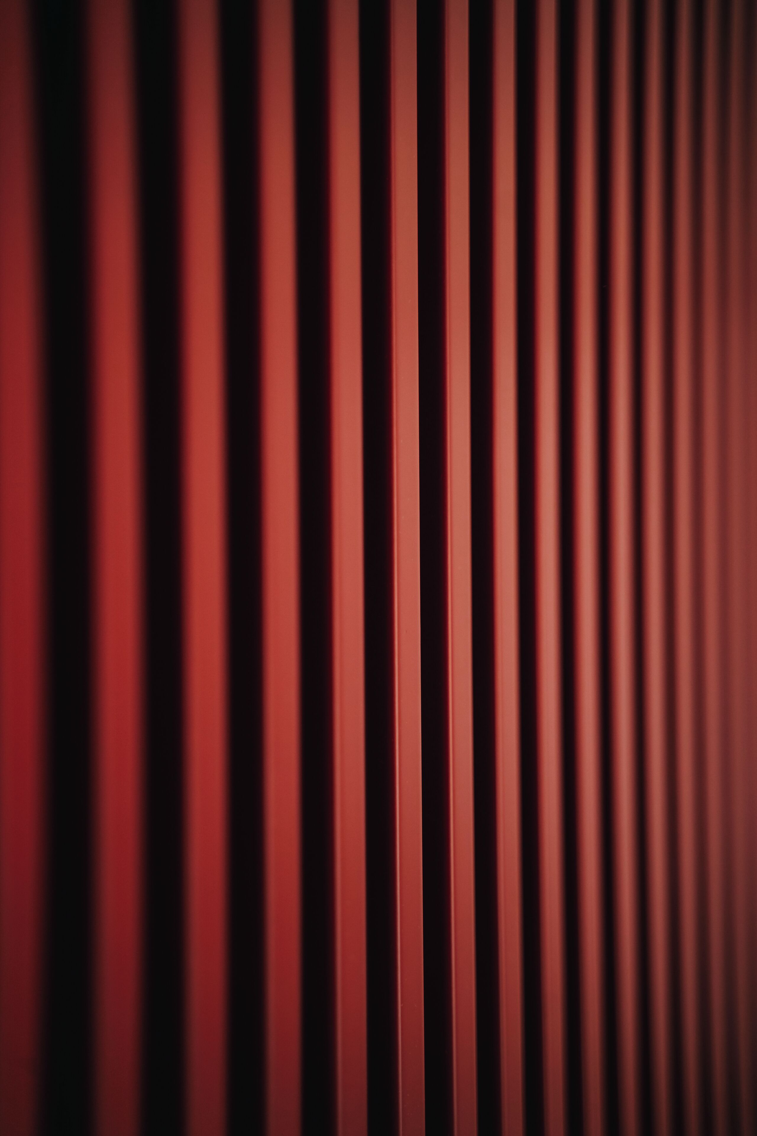 A close-up of vertical lines, likely part of a wall or structure.