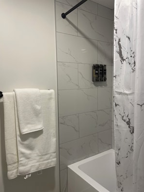 Shower, towels, soap, toilet paper