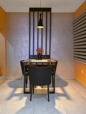 Deluxe Room, Balcony, City View | Dining - Noble Lite Suites (Abuja)