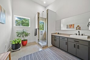 Shower, hair dryer, towels, soap