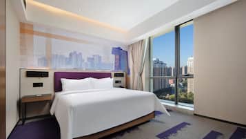 Classic Studio Suite, City View | Desk, laptop workspace, blackout drapes, iron/ironing board