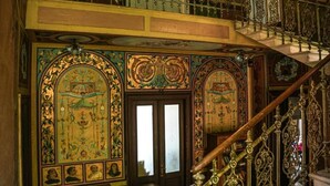 An ornate staircase with intricate metalwork and a balcony with decorative railings. - Onyx Apartments 2&4 (Dubrovnik)
