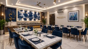 A restaurant with marble tables, blue chairs, and a modern interior design. - OPO ALPINE TREE (New Delhi)