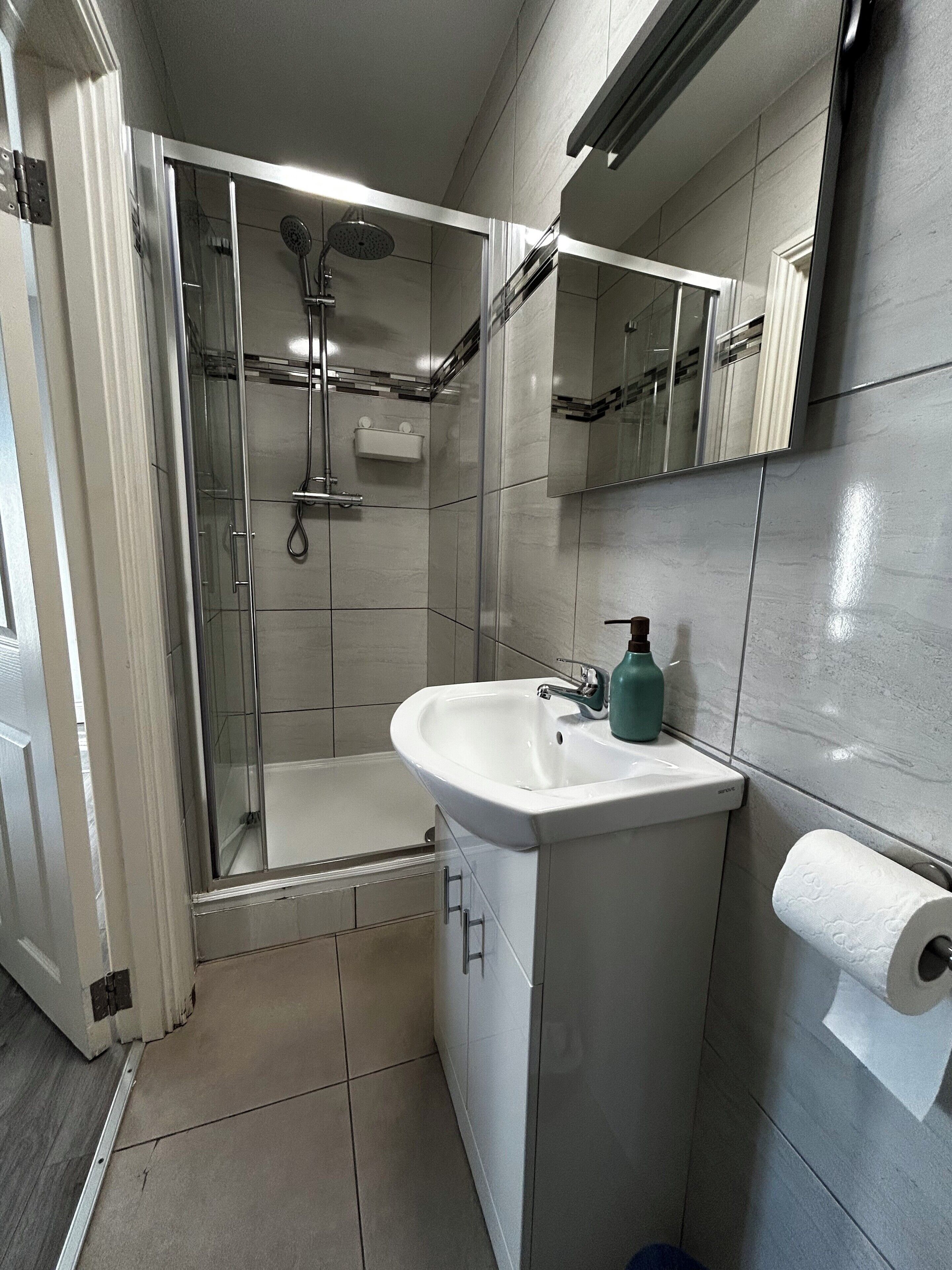 Shower, hair dryer, towels, soap