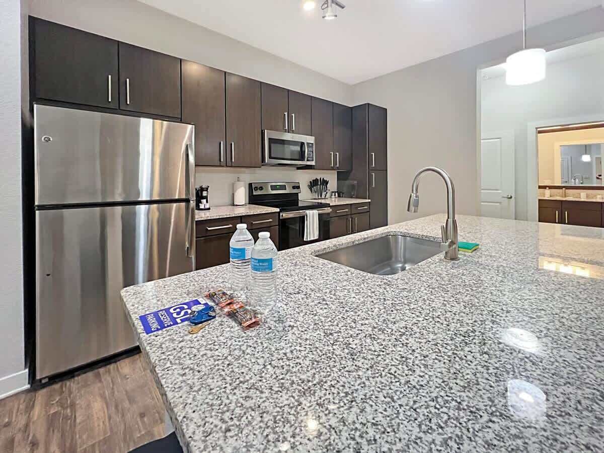 Coffee/tea maker, fridge, stovetop, toaster