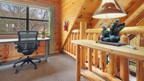 A wooden interior with a desk, chair, lamp, and staircase. - Luxury Views and Prime Smoky Mountain Location (Sevierville)