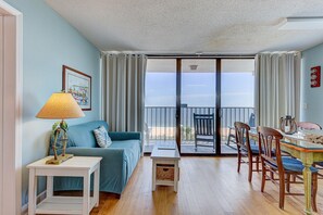 TV, books - Oceanfront 2BR condo in Carolina Beach with stunning views and shared pools. (Carolina Beach)