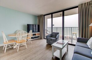 Living area - Enjoy oceanfront bliss in 0612 Sandy Feet Retreat, a 2BR condo in Carolina Beach. (Carolina Beach)