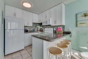 Fridge, microwave, oven, stovetop - Enjoy oceanfront views at 0701 The Green Starfish, a cozy 1-bedroom retreat in Carolina Beach. (Carolina Beach)