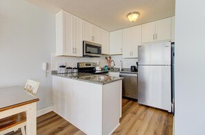 Private kitchen - Experience oceanfront bliss at 0705 Palms That Sway, a cozy 1-bedroom retreat in Carolina Beach. (Carolina Beach)