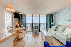 Living area - Experience oceanfront bliss in this cozy 1-bedroom retreat in Carolina Beach. (Carolina Beach)