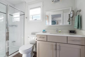 Shower, hair dryer, towels, shampoo