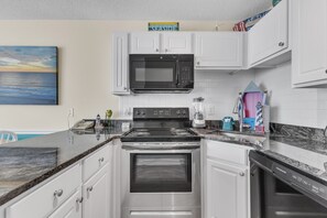 Fridge, microwave, oven, stovetop - Enjoy oceanfront views from this 1-bedroom gem in Carolina Beach, perfect for 6! (Carolina Beach)