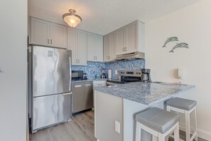 Fridge, microwave, oven, stovetop - Oceanfront charm at 1008 Blue Dolphin, a cozy 1-bedroom in Carolina Beach. (Carolina Beach)