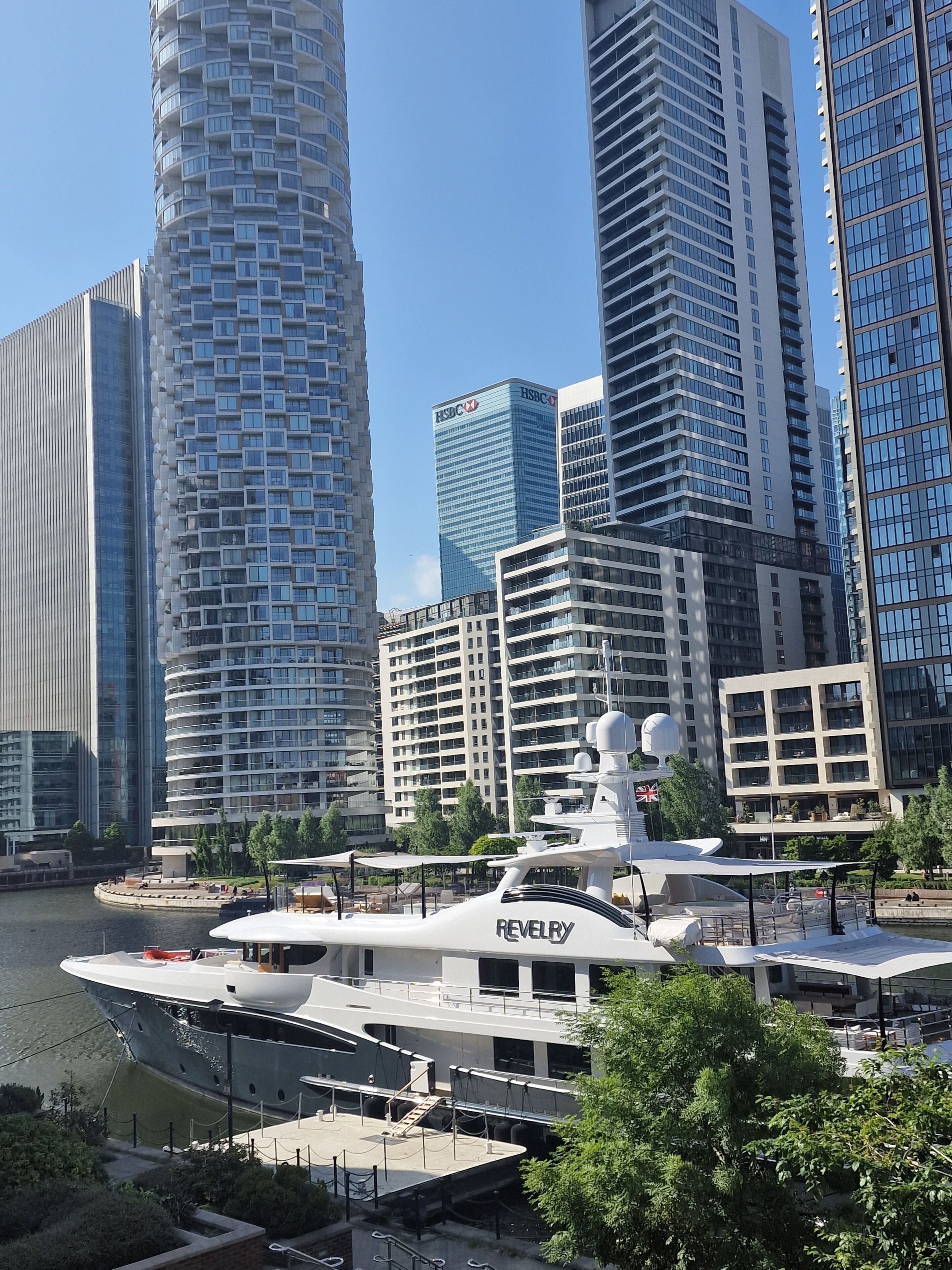 A modern cityscape with high-rise buildings, including a prominent HSBC building.