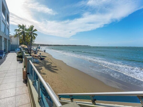On the beach, sun-loungers, beach towels - Spectacular 2BDRM beachfront Cabarete condo. Steps to nightlife & vibrant Comm, (Cabarete)