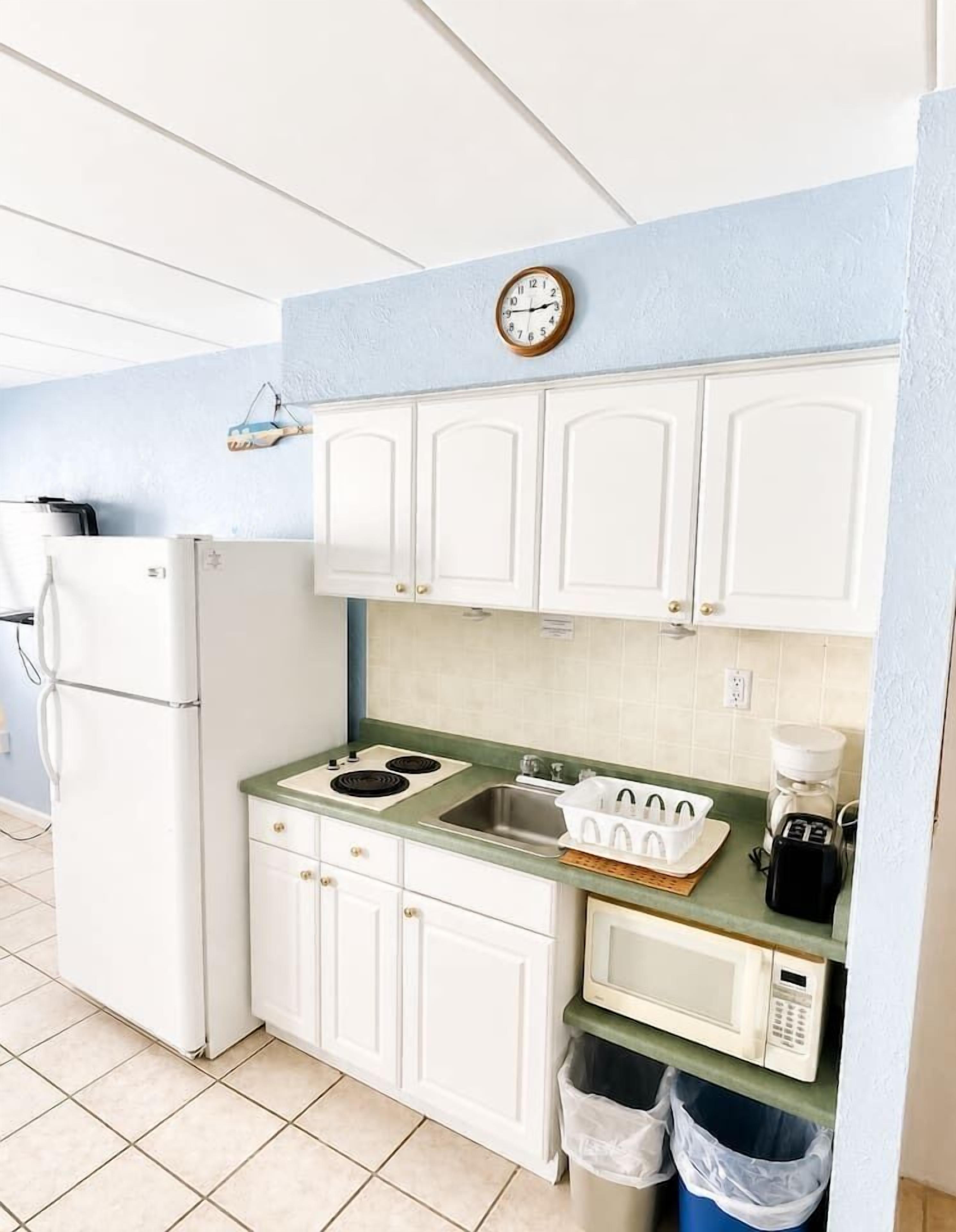 Fridge, microwave, stovetop, coffee/tea maker