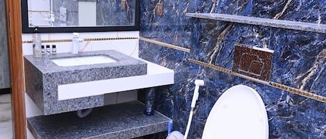 Shower, towels, soap, toilet paper