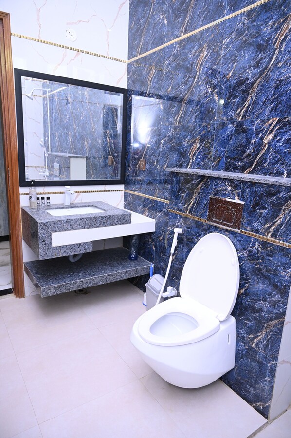 Shower, towels, soap, toilet paper