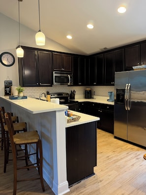 Coffee/tea maker, fridge, microwave, oven