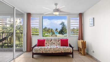 Apartment, Balcony, Pool View | Living area | 32-inch flat-screen TV with digital channels