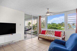 Apartment, Balcony, Pool View | Living area | 32-inch flat-screen TV with digital channels