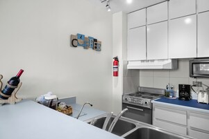 Deluxe Apartment, Balcony, Pool View | Private kitchen