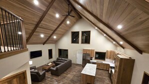 A loft-style apartment with a kitchen, living area, and dining space. - Deadwood Cabin-Sleeps 12-Hot Tub-4X4 Trails-Central (Deadwood)
