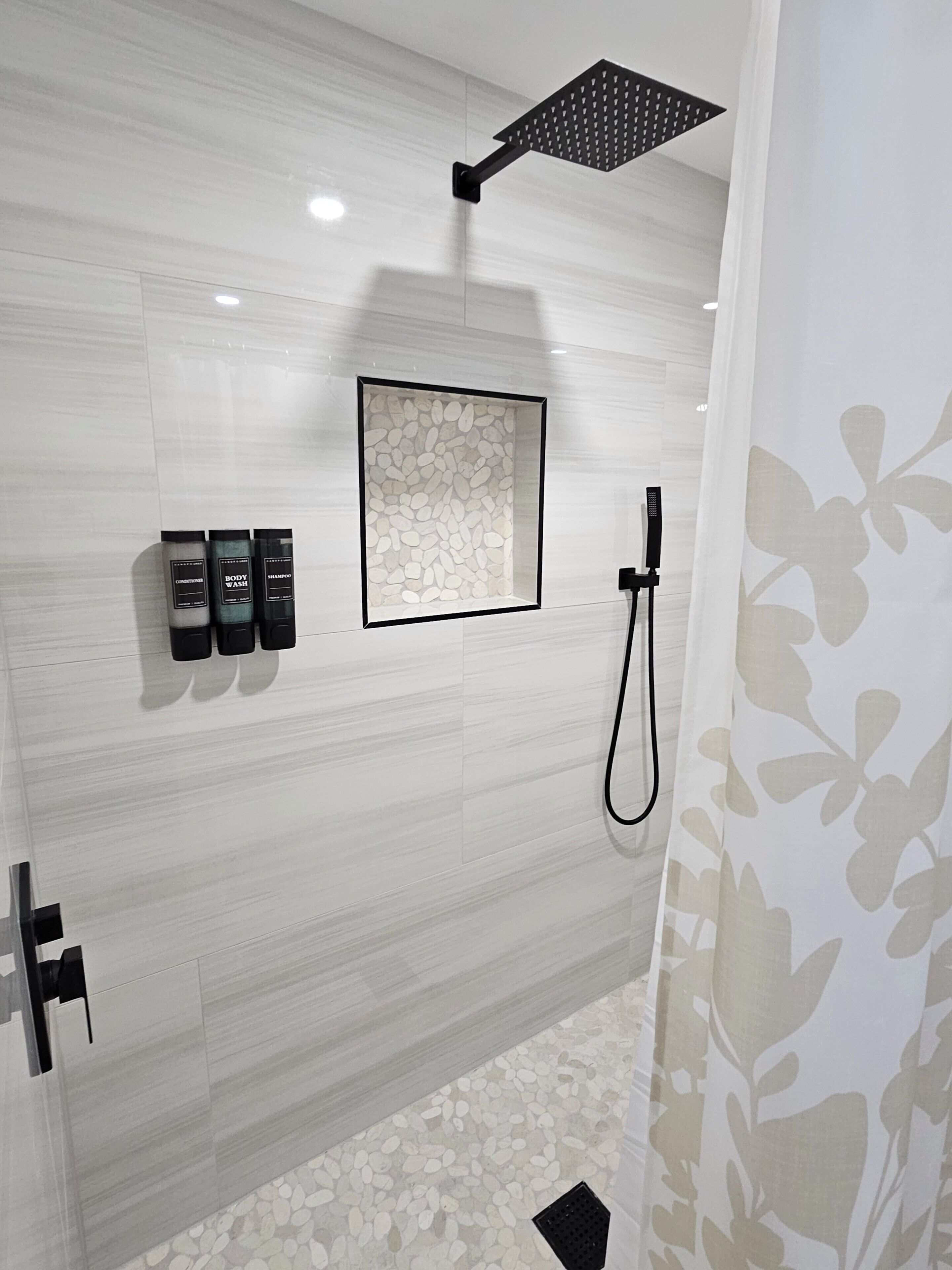 Shower, hair dryer, towels, toilet paper