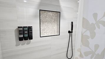 Shower, hair dryer, towels, toilet paper