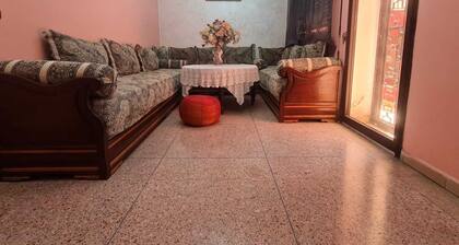 Cozy Villa bedroom with balcony : private bath accessed via shared space.