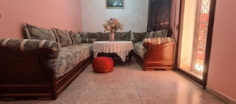 Cozy Villa bedroom with balcony : private bath accessed via shared space.