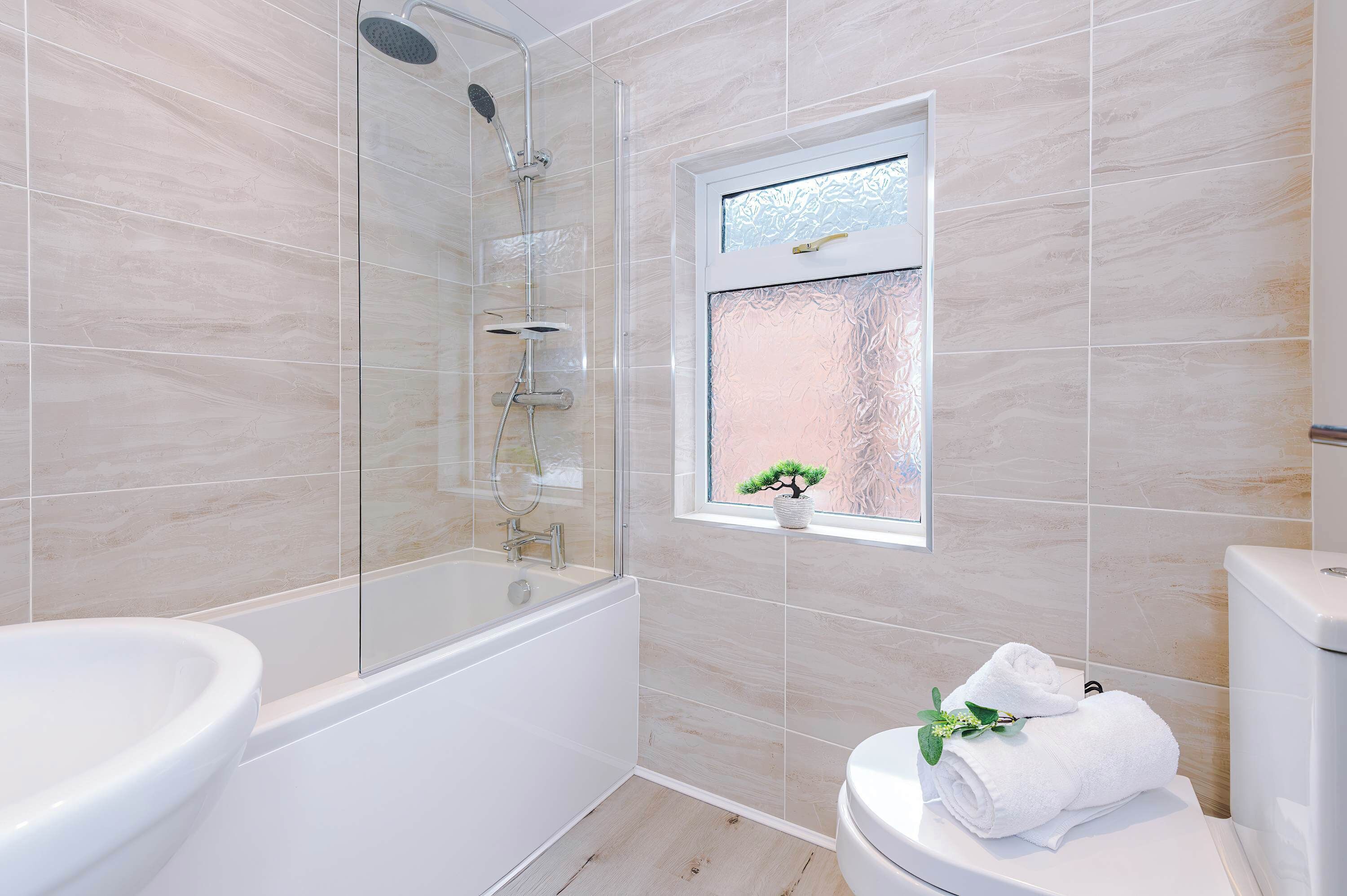 Shower, hair dryer, towels, shampoo