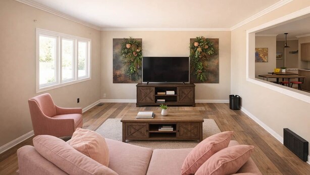 A living room with a TV, wooden entertainment unit, pink sofa, and a view into the dining area.