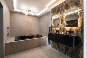 A modern bathroom with a black vanity, two mirrors, and a marble wall. - Luxury City 5* Retreat-Lux Spa Bath-Romantic (Edinburgh)
