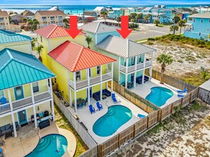 A beachfront property with multiple buildings, a swimming pool, and a view of the ocean. - 2 Side-by-Side Homes | 8BR, 2 Private Pools, Sleeps 28, Walk to Beach (Panama City)