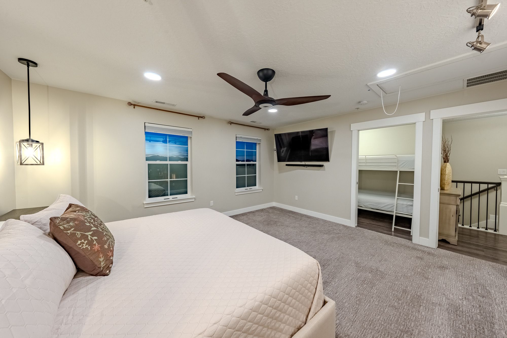 Bedroom with a large bed and wall TV