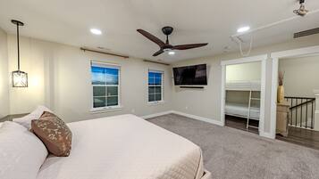 Bedroom with a large bed and wall TV