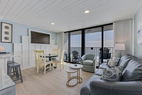Living area. Oceanfront retreat in Carolina Beach – cozy 1-bedroom condo for 5 guests!
