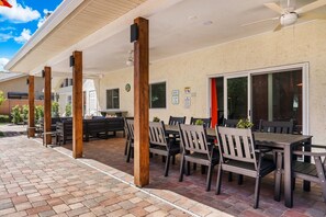 Outdoor dining - 7BR Beach Dream House - Pickleball, Theater, Pool! (Seminole)