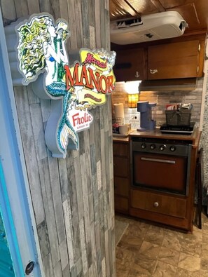 Fridge, microwave, stovetop, coffee/tea maker - Mermaid Manor Travel Trailer (Savannah)